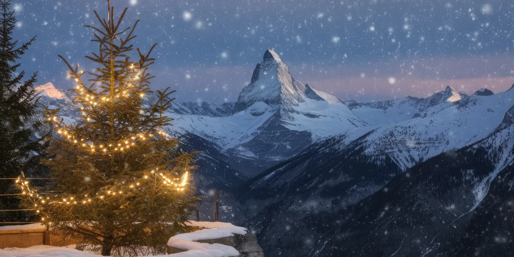 A lit Christmas tree and the Matterhorn under falling snow