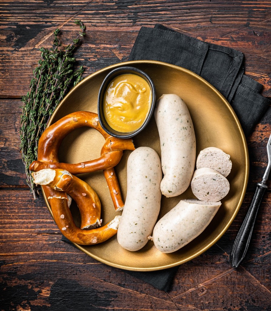 Bavarian Weisswurst served with sweet mustard and a pretzel.