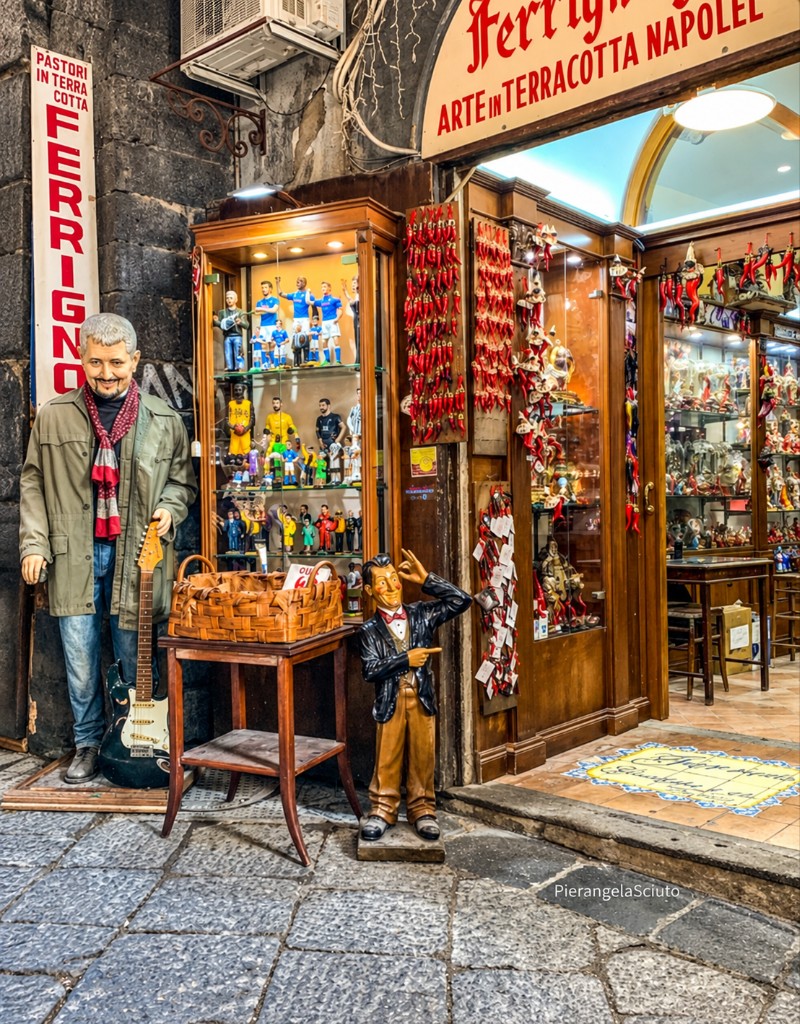 Nativity figurines displayed outside a workshop on Via San Gregorio Armeno in Naples.
