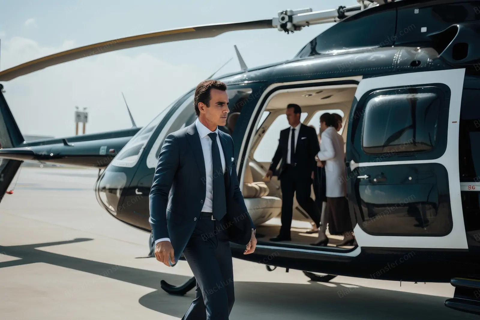 Passengers boarding a dark helicopter on an airport apron