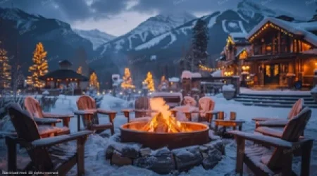 Luxury outdoor fire pit on the snow with mountain chalet background at sunset